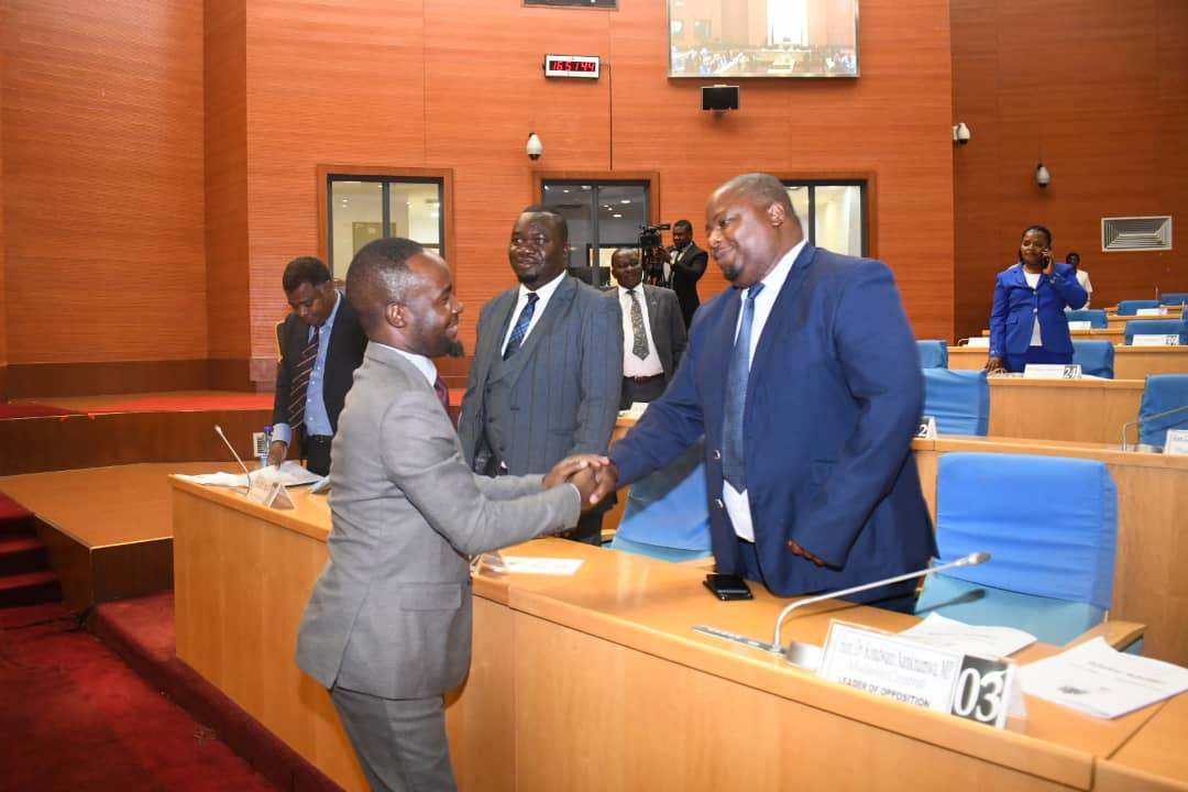 Malawi Minister of Finance left shaking hands with Leader of Opposition Malawi Parliament